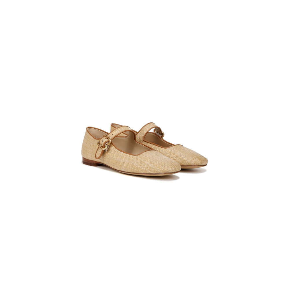Stylish beige ballet flats with a strap and buckle detail, perfect for casual wear and comfort.
