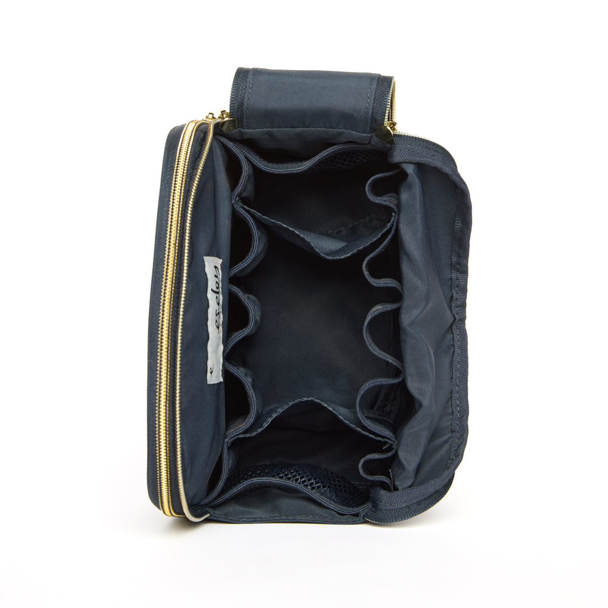 Navy blue bag with gold zipper on a white background open to show all compartments.