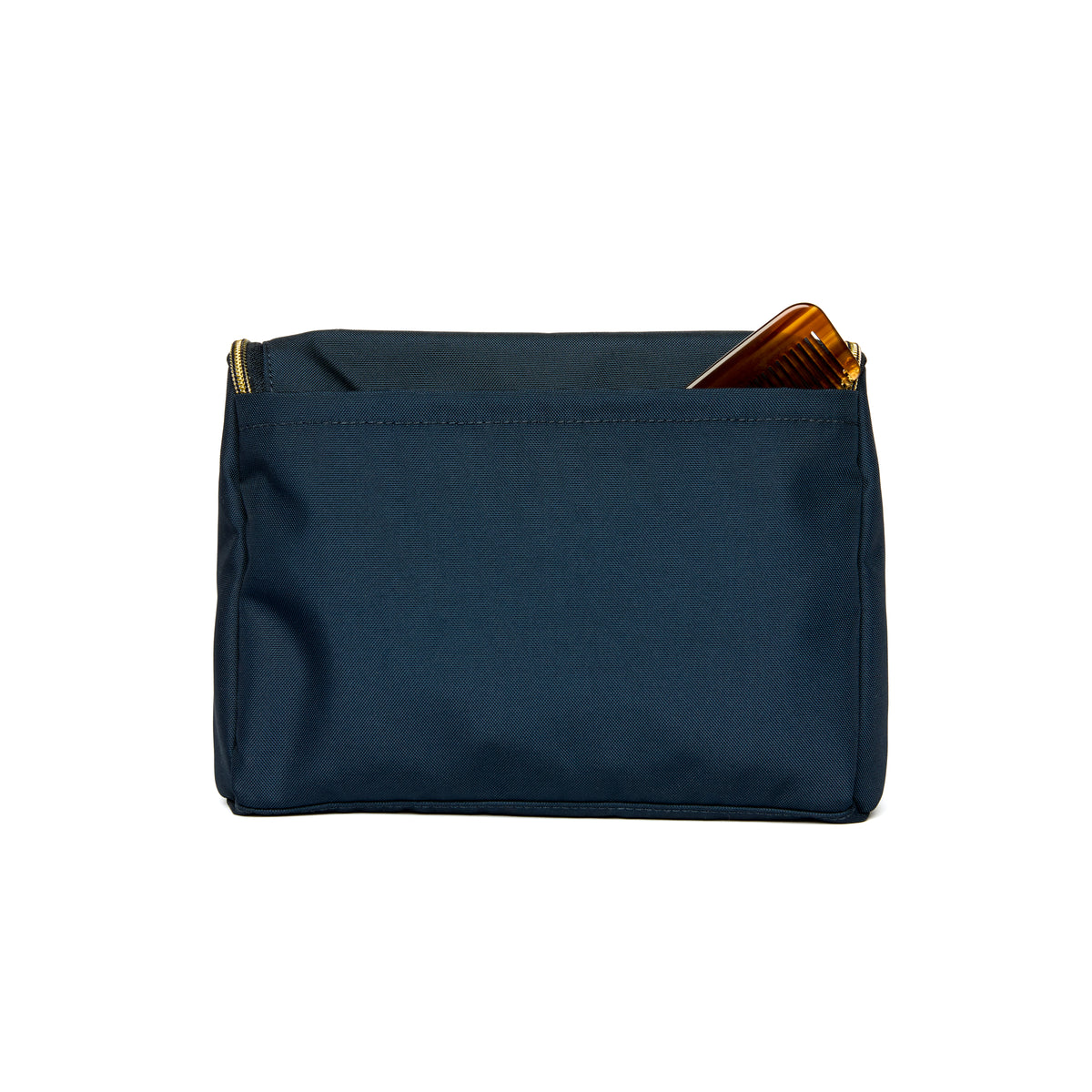 Lindsay Albanese eseley Dopp Kit in navy on a white background back view with a comb in back pocket.