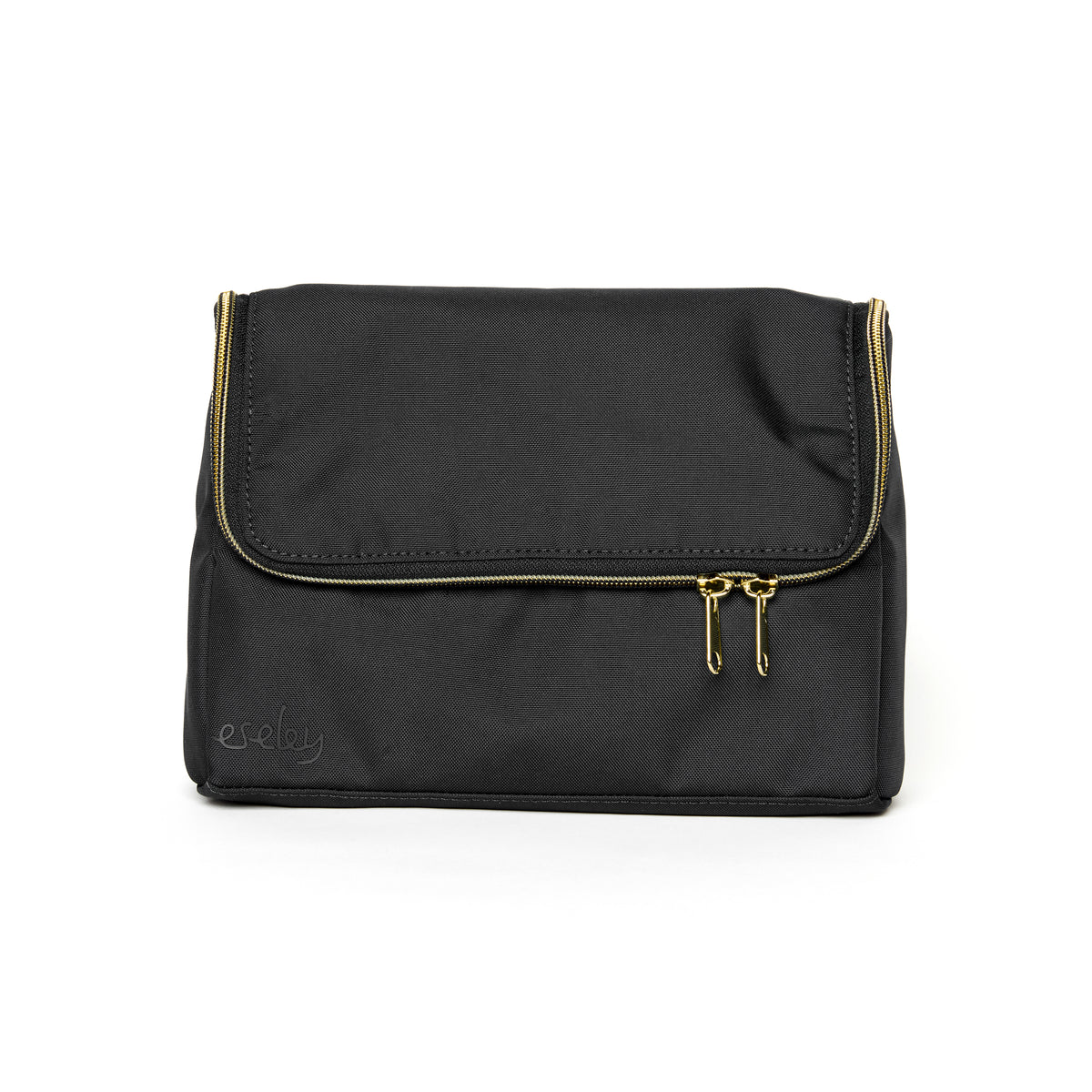 Lindsay Albanese eseley Dopp Kit in navy on a white background zipped closed.