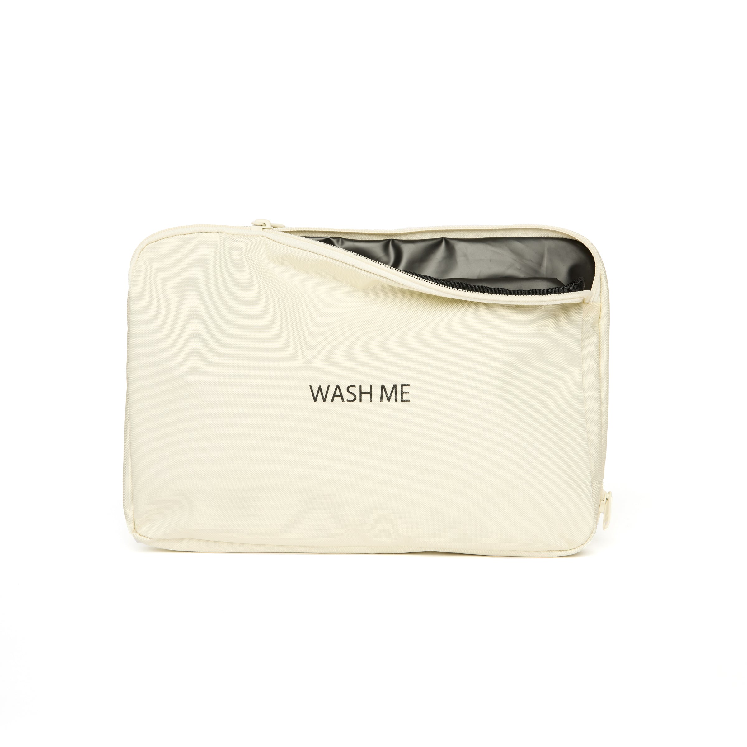 Beige toiletry bag with black interior and 'WASH ME' text on a white background