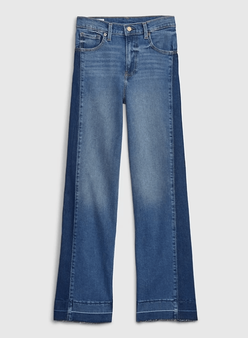 Wide-leg two-tone denim jeans with frayed hems, showcasing a trendy, casual style.