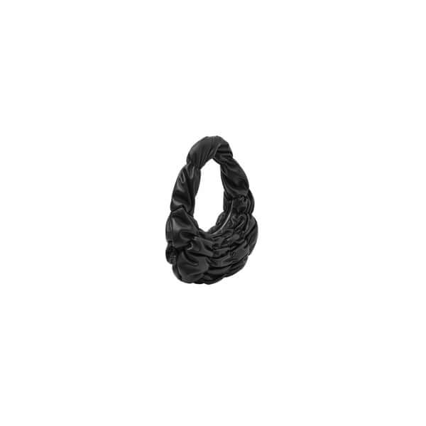 Stylish black fabric scrunchie showcasing a unique twisted design for hair styling.
