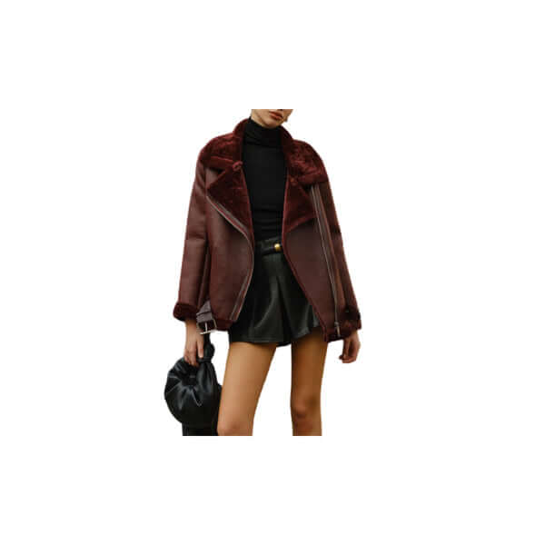 Woman wearing a stylish burgundy shearling jacket with a black top and mini skirt.