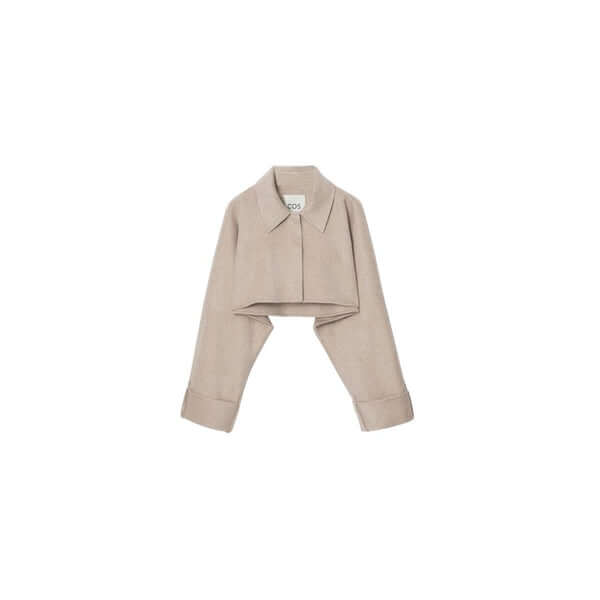 Stylish cropped beige jacket with collar, perfect for layering in modern fashion.