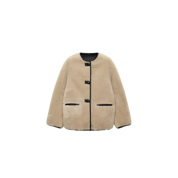 Cozy beige fleece jacket with black detailing and button closure, perfect for stylish winter outfits.
