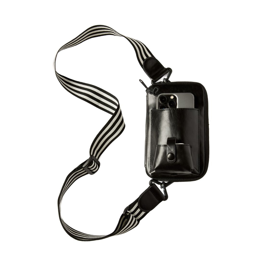 Black crossbody bag with a striped pattern on the strap on a white background