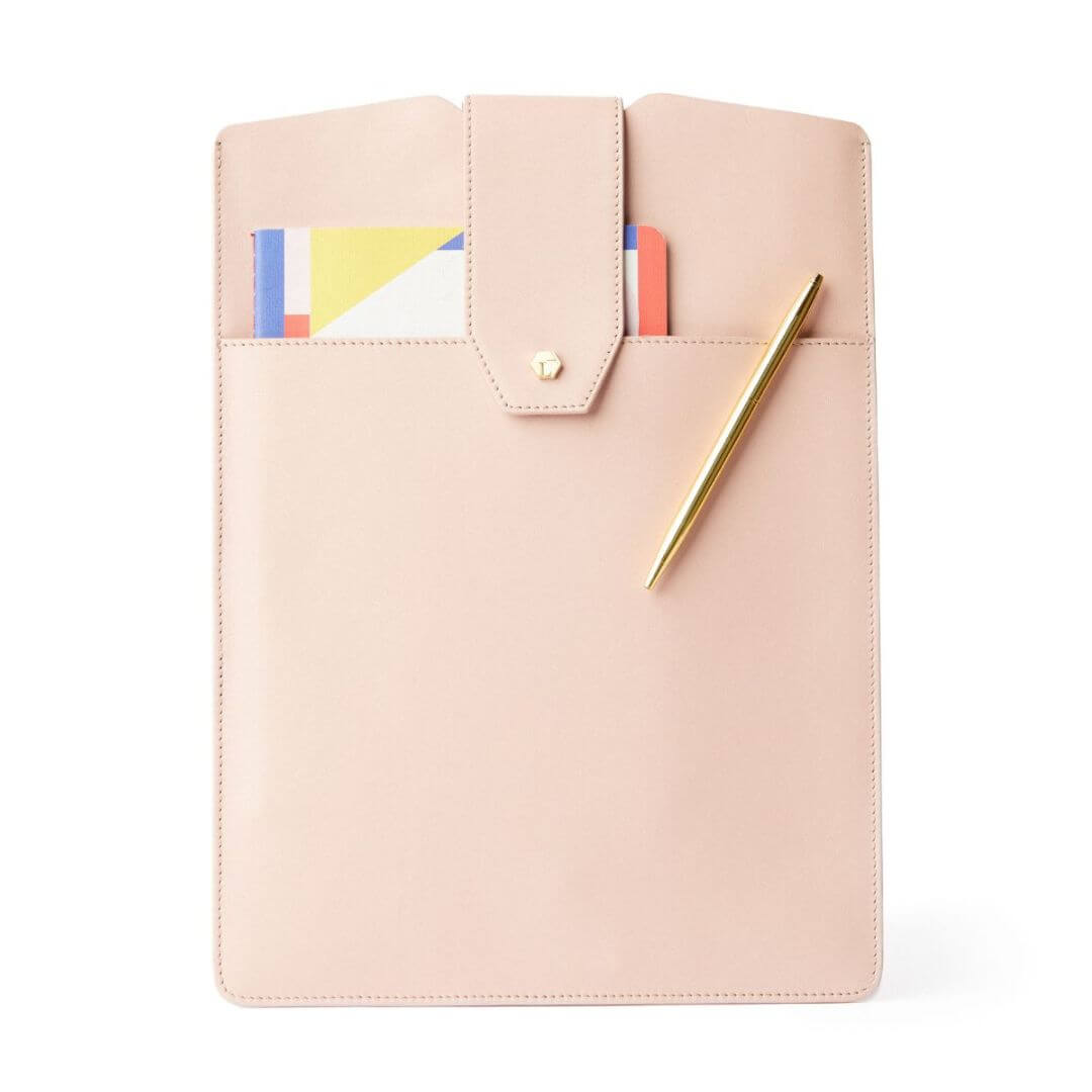 The Daily Laptop Clutch made from 100% genuine leather with front pocket holding a notepad, iPhone, and pen. Sleek and slim laptop sleeve.