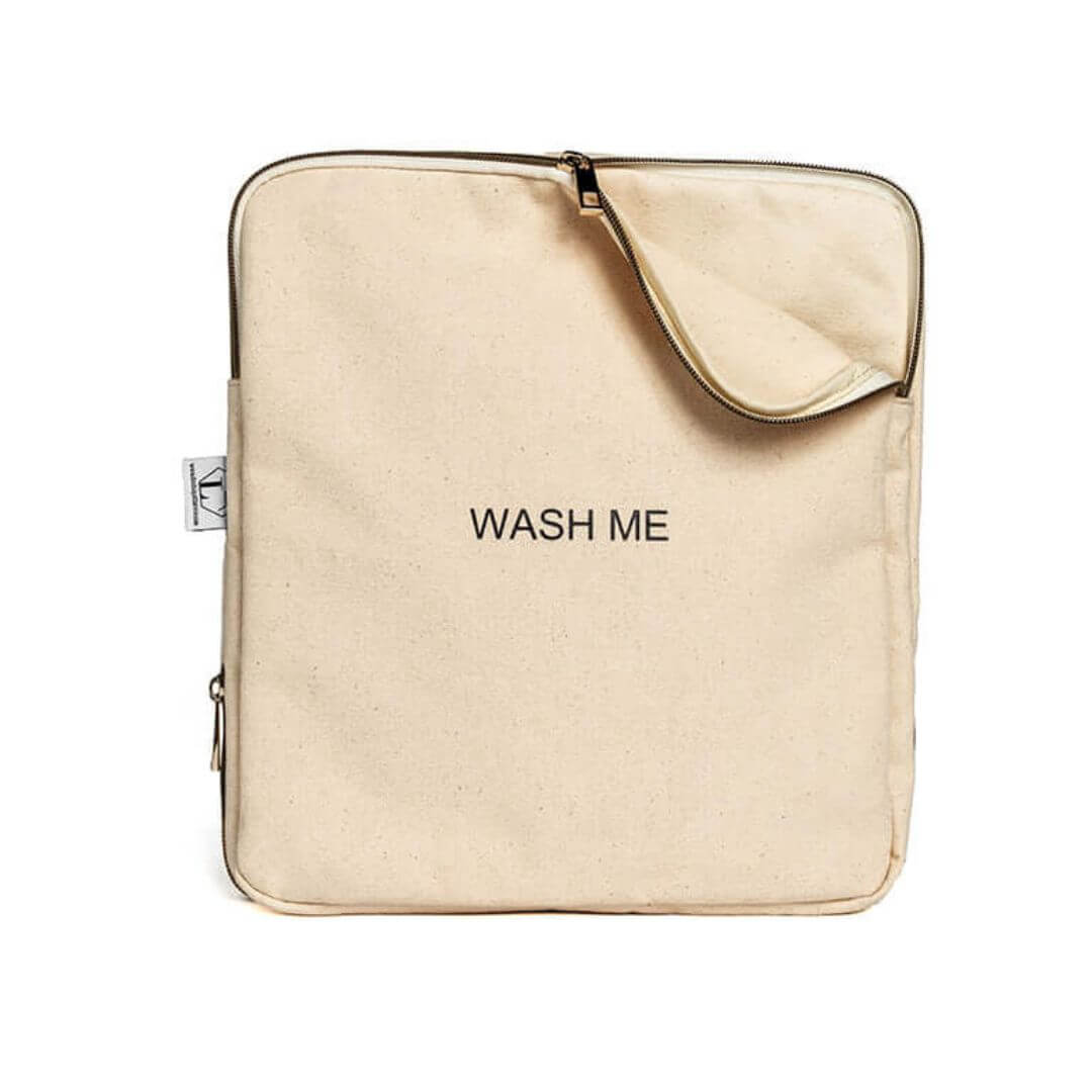 Two-sided travel laundry bag with "Wash Me" text, zipper, and divider for separating clean and dirty clothes on extended trips.