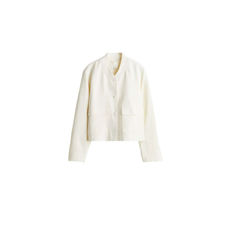 Stylish white blazer jacket with button closure and front pockets for a chic look.