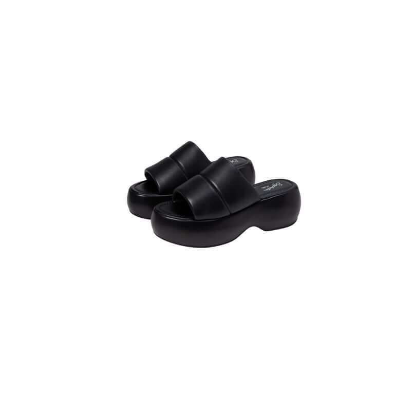 Black platform slide sandals with an open design, perfect for casual and stylish summer wear.