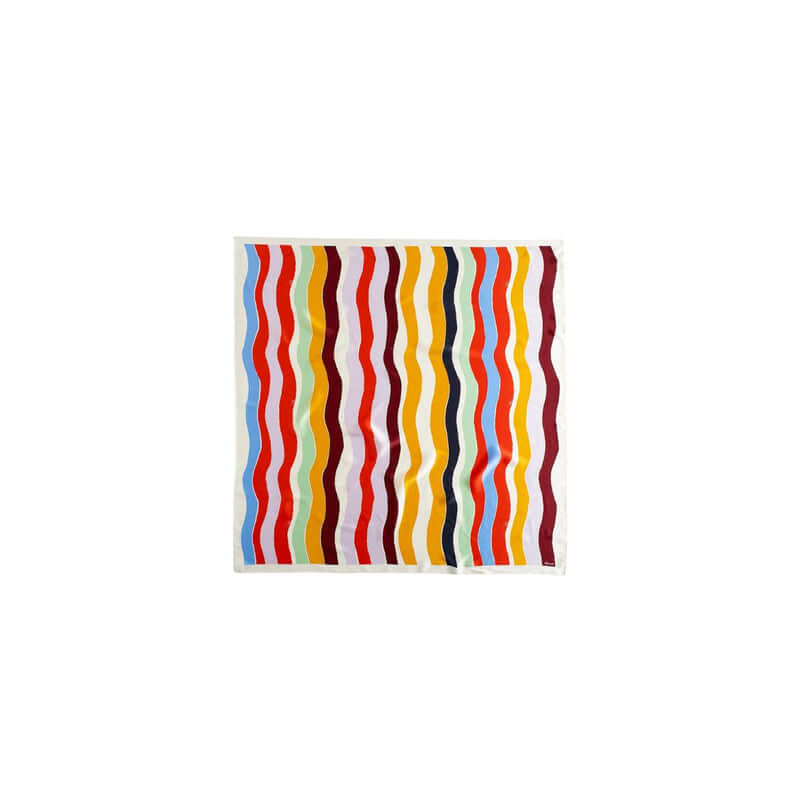 Colorful wave pattern fabric with bold stripes in red, yellow, blue, and brown, perfect for modern decor.