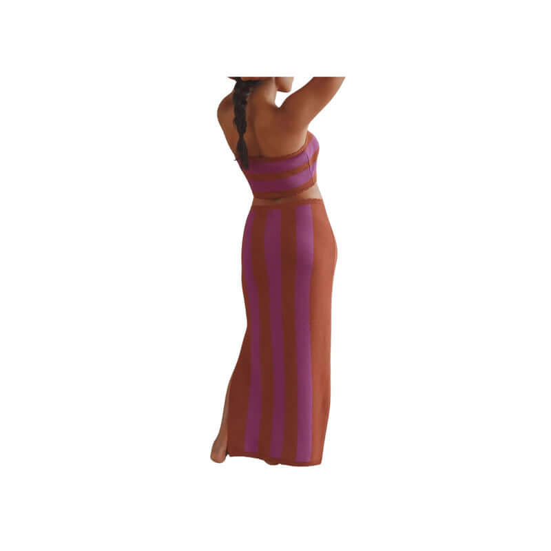 Stylish woman in a purple and brown striped two-piece outfit, showcasing summer fashion trends from a back view.