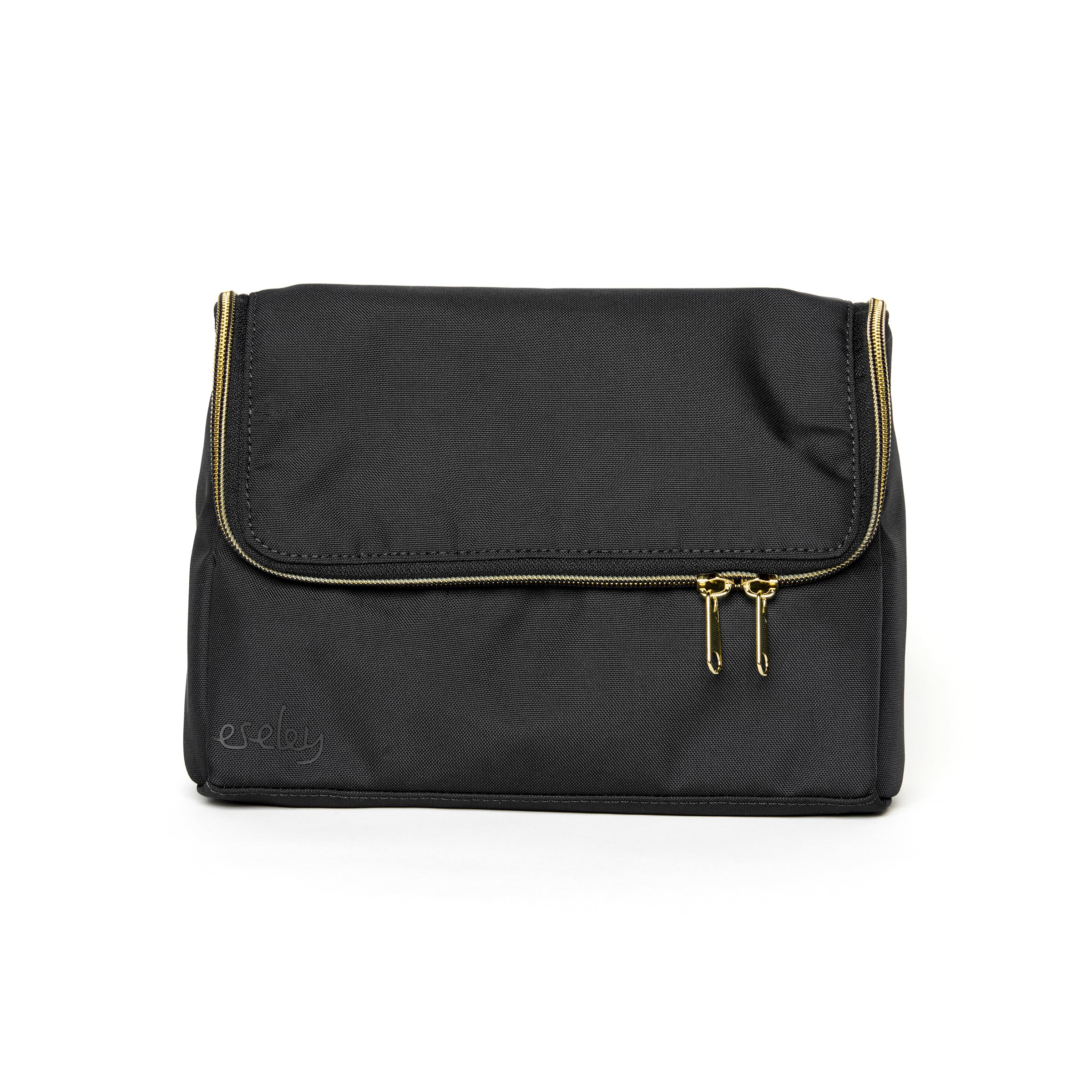 Lindsay Albanese eseley Dopp Kit in navy on a white background zipped closed.