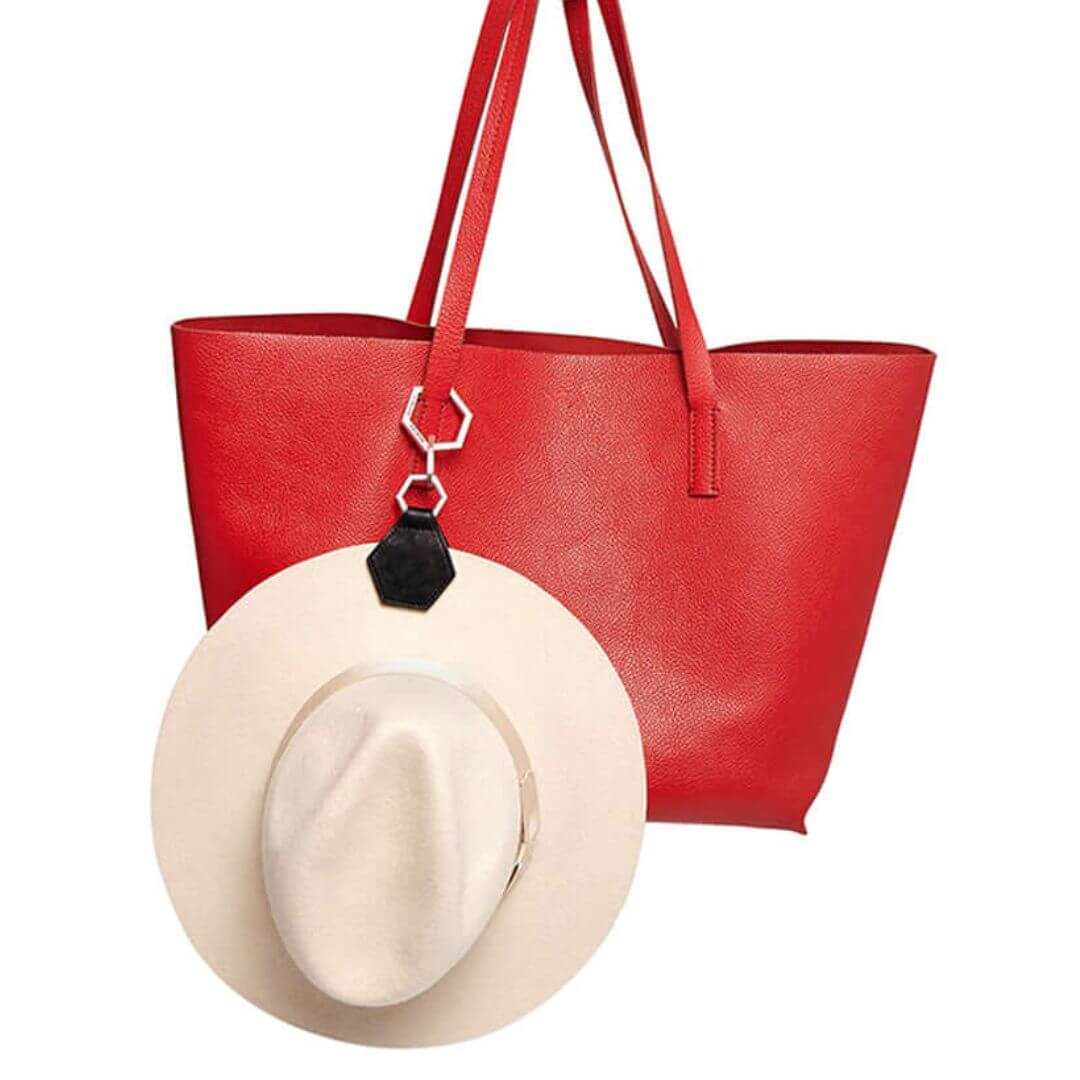 Hex TOPTOTE by Lindsay Albanese magnetic hat clip with gold hardware and genuine leather attached to white fedora hat